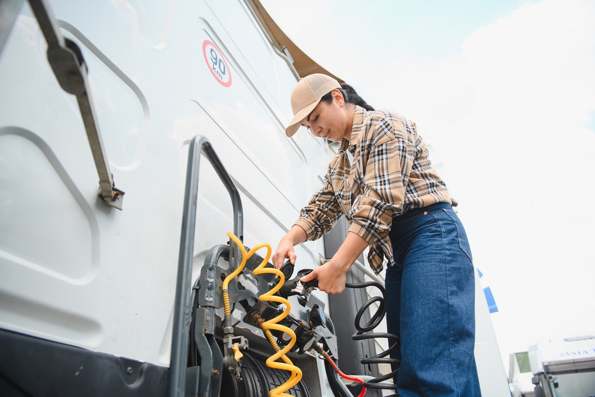 Measuring the distance from a U.S. RV pedestal to a trailer with both 30A TT‑30 and 50A 14‑50 cords laid out for planning